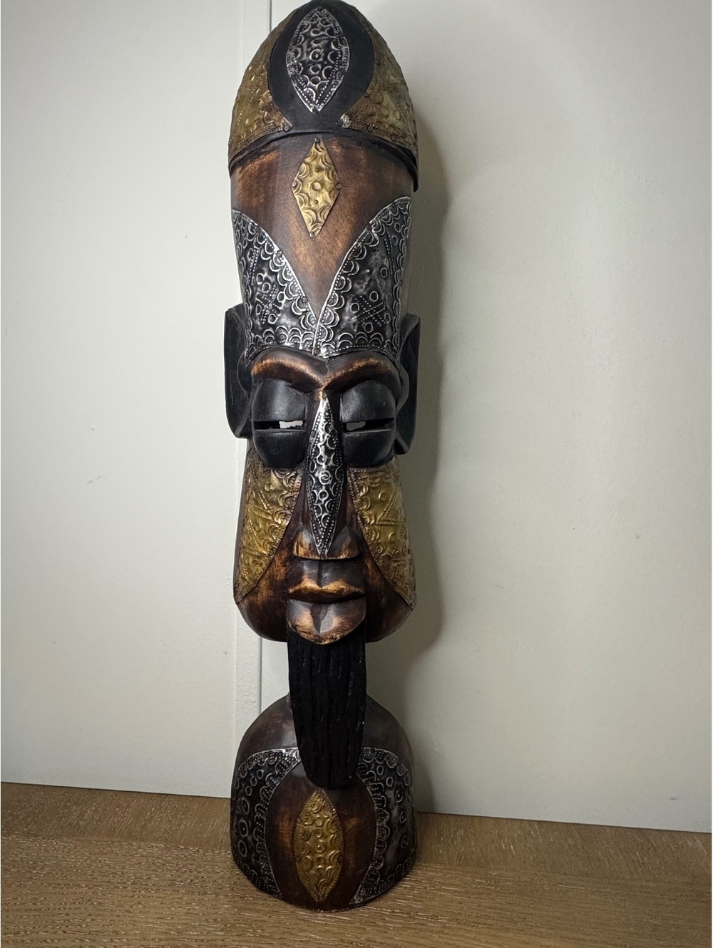 Tall carved wooden face mask